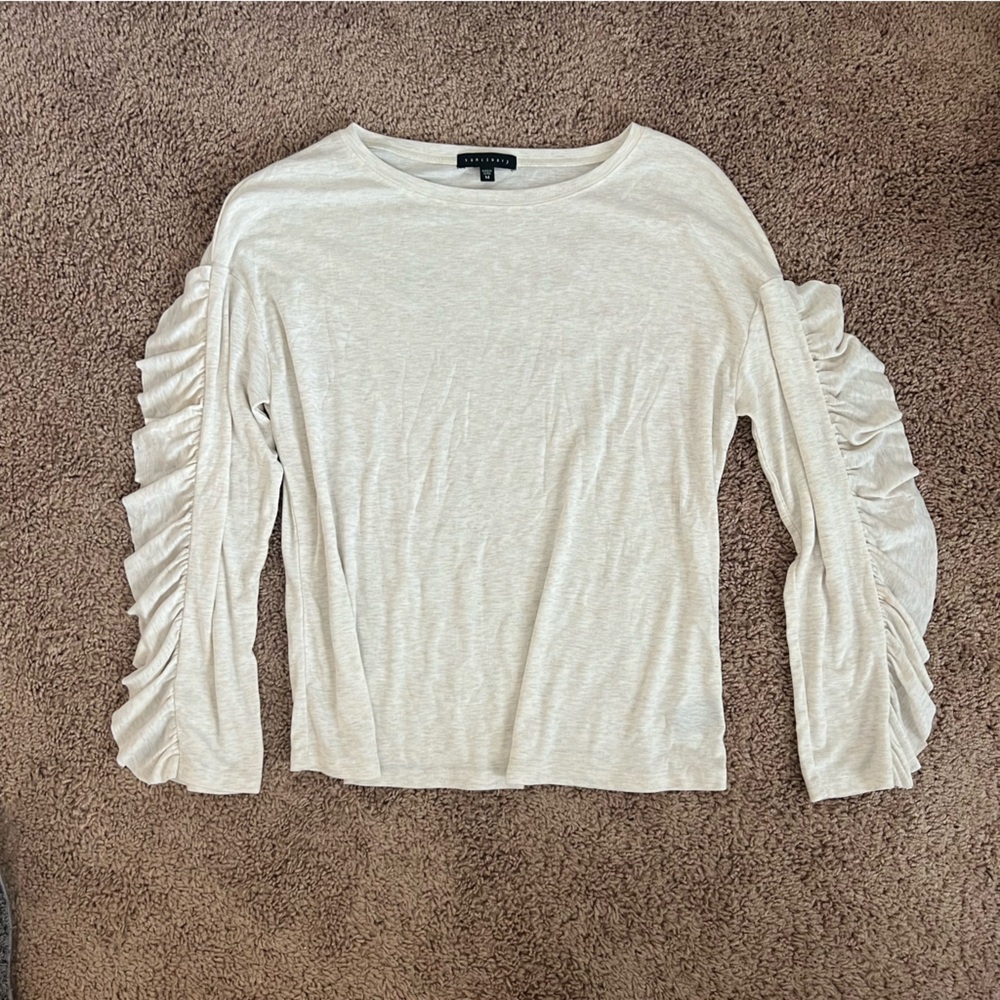 Cream long sleeve shirt with ruffled sleeves